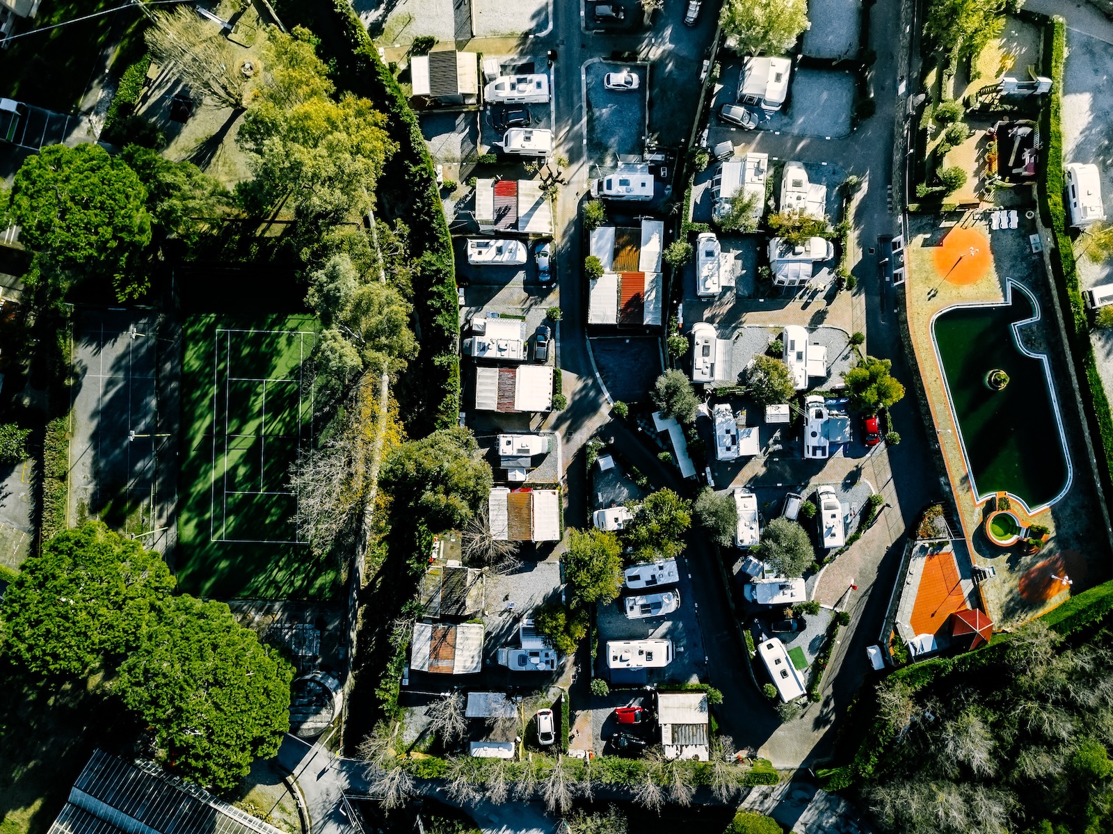 Aerial view of a holiday park with caravans set up at their sites